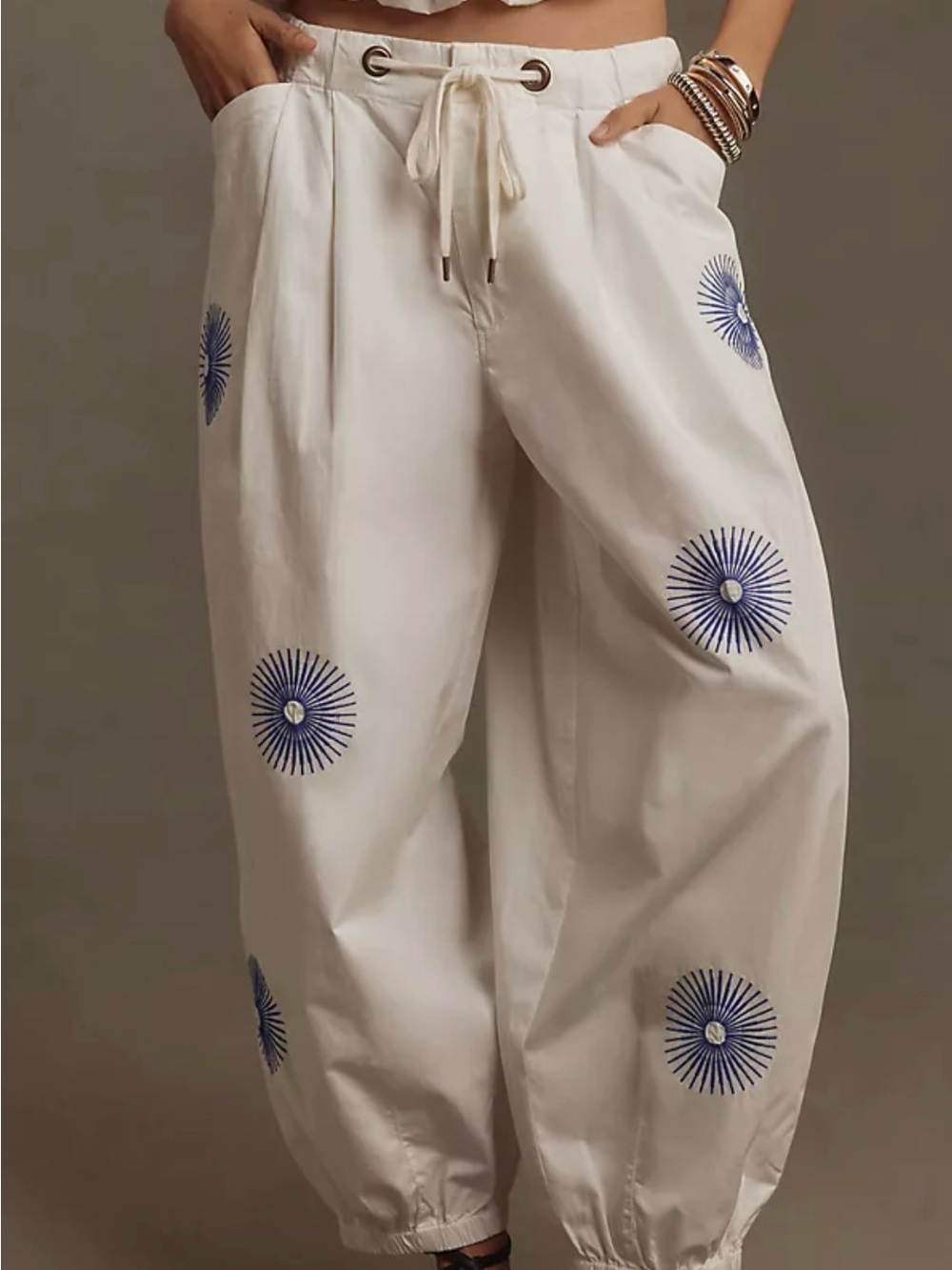 Anthropologie Pilcro Cream Drawstring Joggers with Blue Sunburst Embroidery